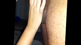 young blonde is wearing fishnets while fucked in the car