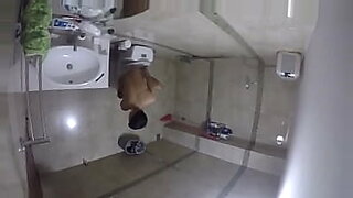 family strokes mom and son in kitchen