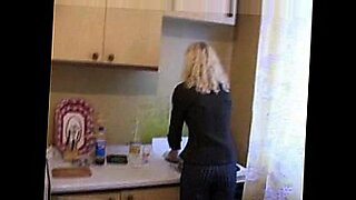 granny-mom-on-cooking-at-kitchen-and-her-son-on-jerkin-at-her-underwear