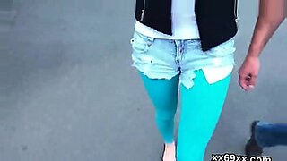 cute horny blonde is outside posing and rubbing her pussy